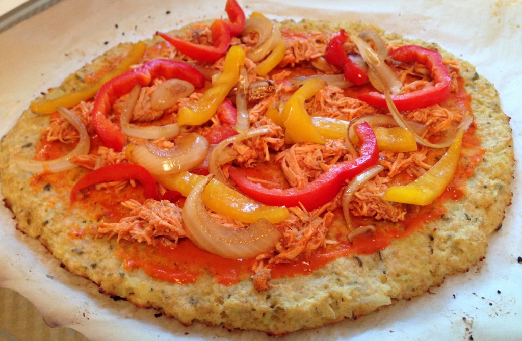 Cauliflower Pizza Crust - guesswhoscooking.com. dairy free, gluten free (option), low carb